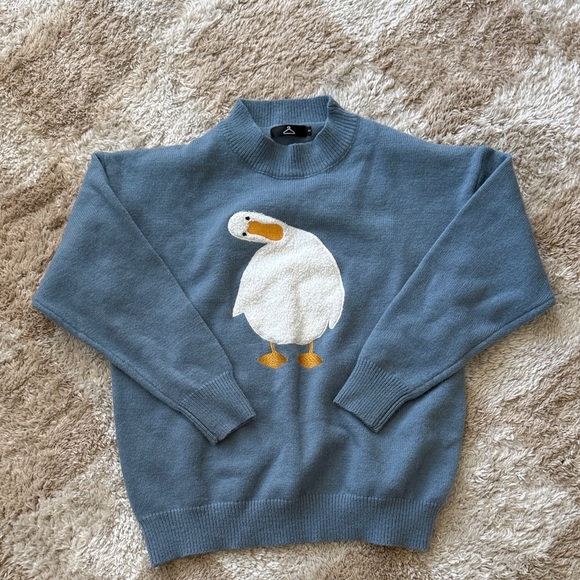 Sweaters - Blue tilted head duck sweater